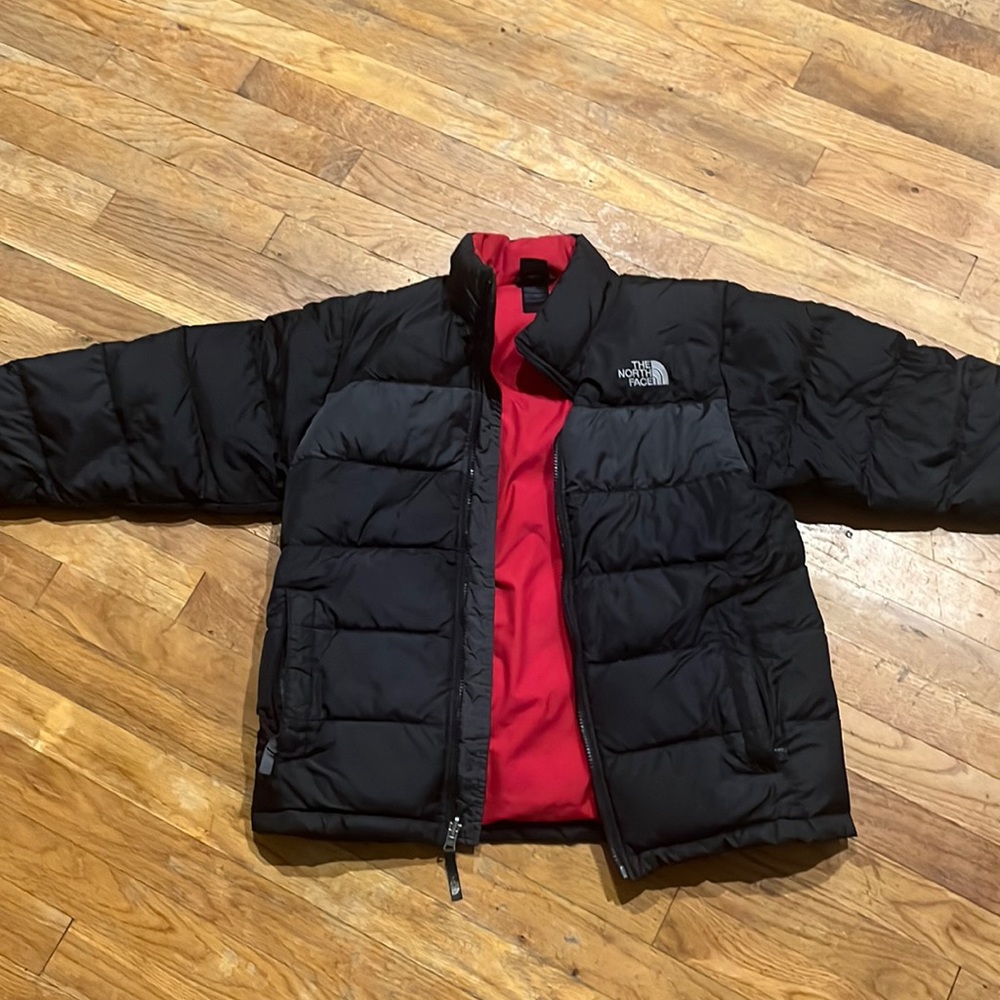 The North Face boys black 550 puffer coat.